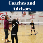 A coach with students in the gym playing volleyball